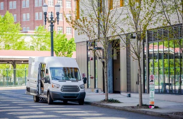 Two people moving boxes
