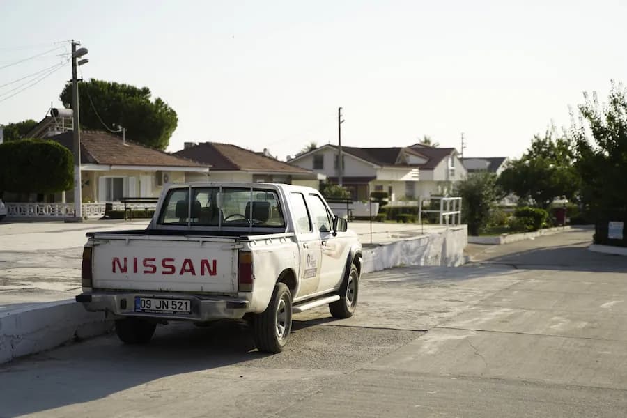 Two people moving boxes