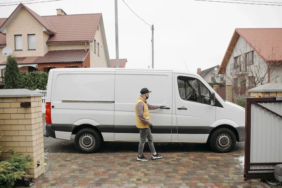 Two people moving boxes