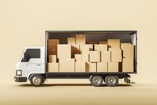 Two people moving boxes