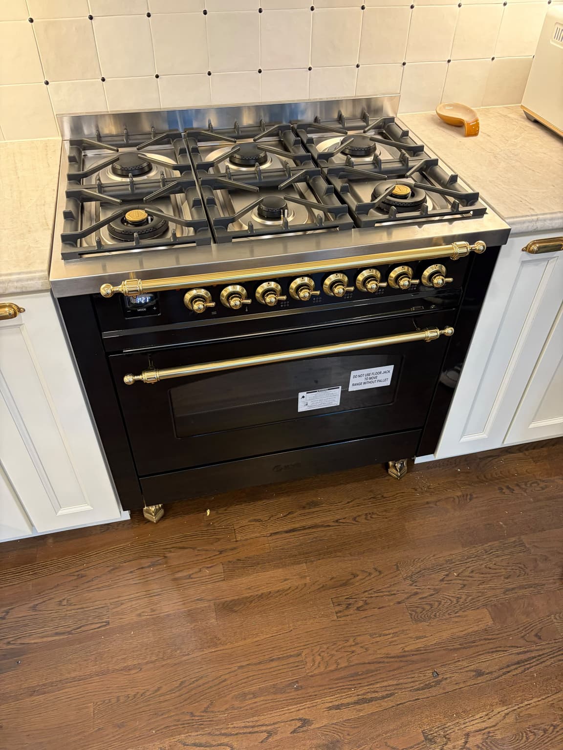 A newly delivered range in a customer's kitchen