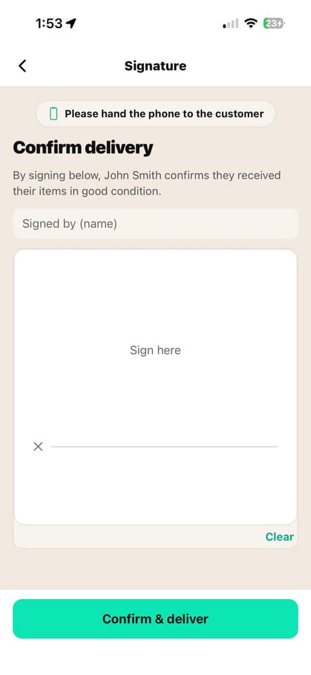 Customer signs for their delivery in the app